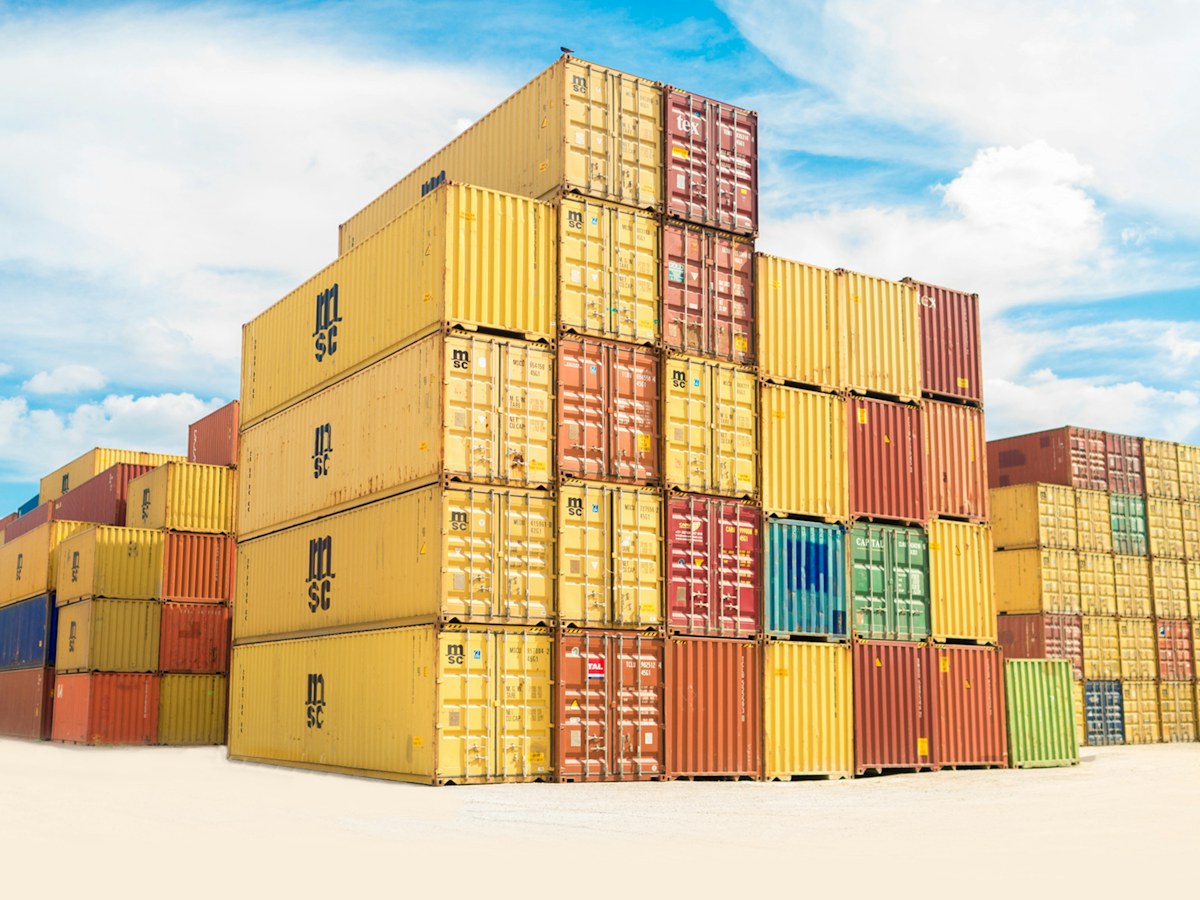 Stacked intermodal shipping containers in different colours