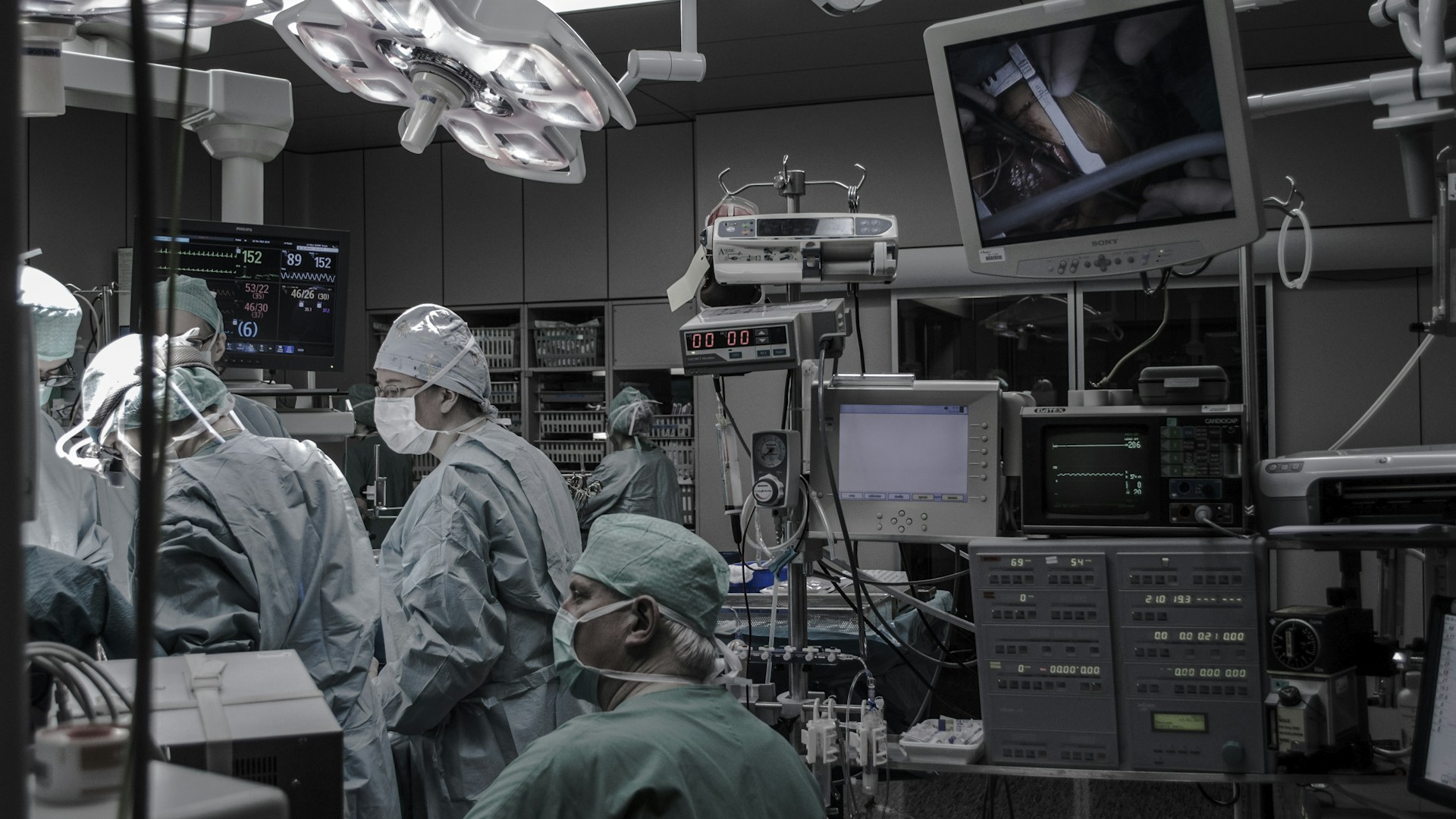 Surgical team in gowns working in an operating room